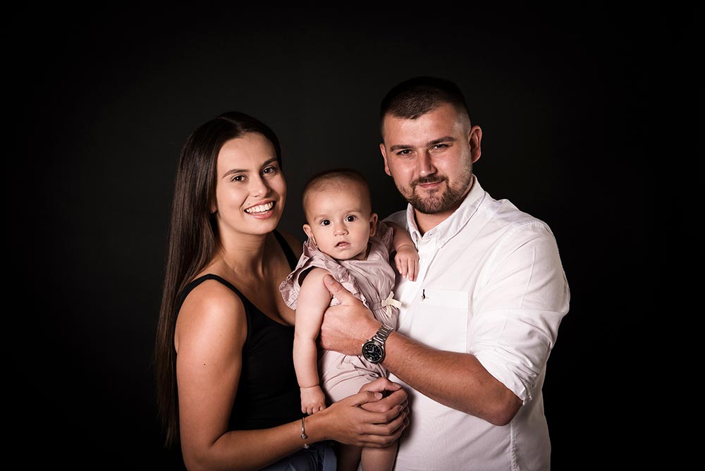 mum & dad with their baby for a baby portrait session