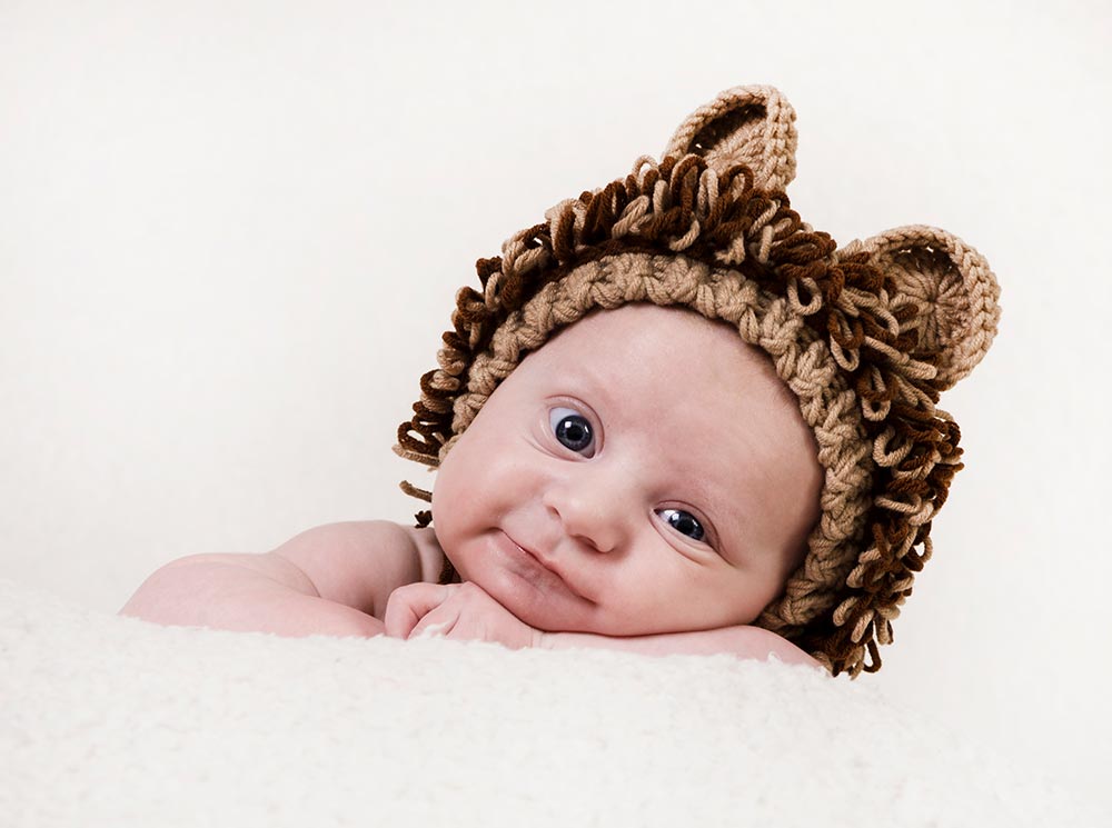 cute baby portrait with a brown hat on