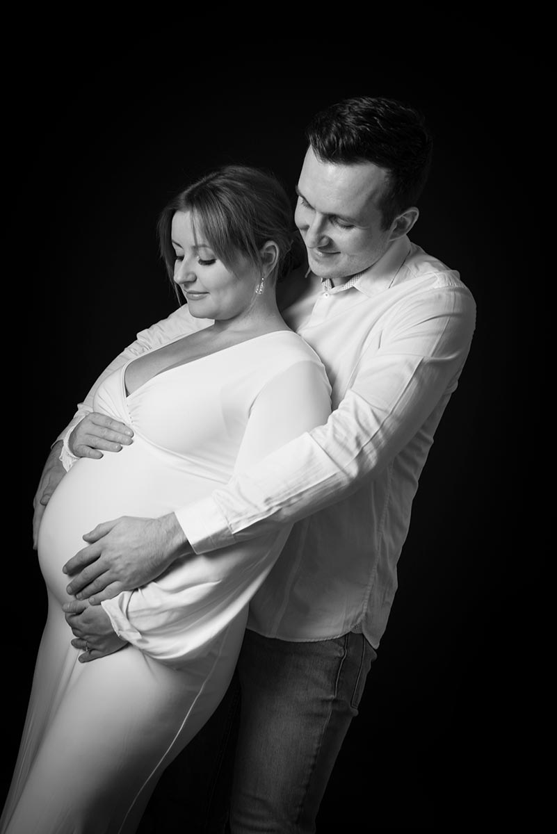 couple with a baby bump for a bump to baby portrait session