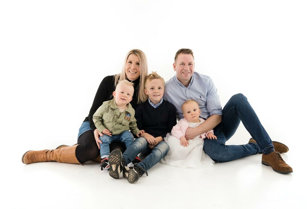A family photography portrait with 3 children